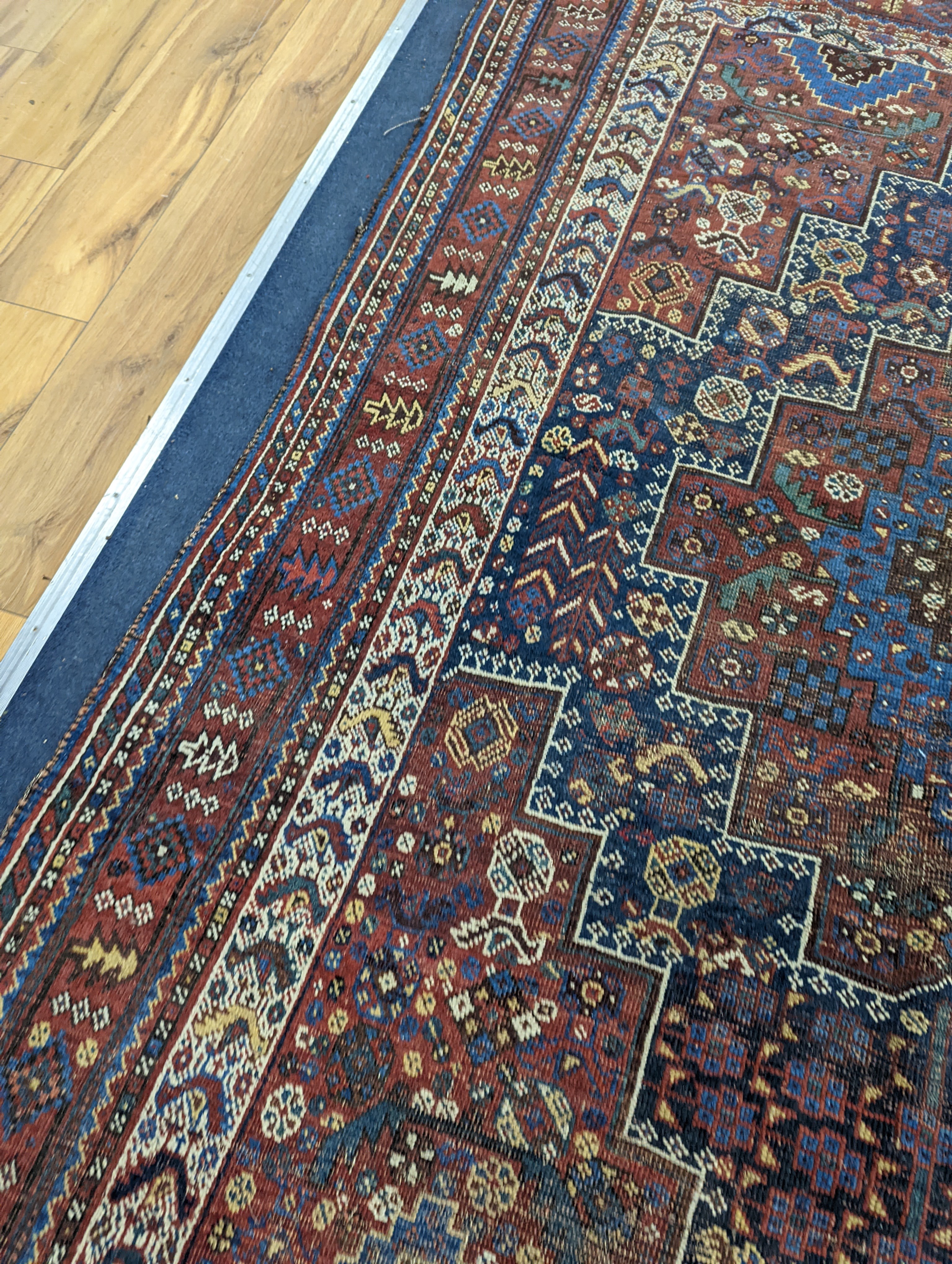 A Caucasian red ground rug and a Belouch rug, larger 200 x 165cm